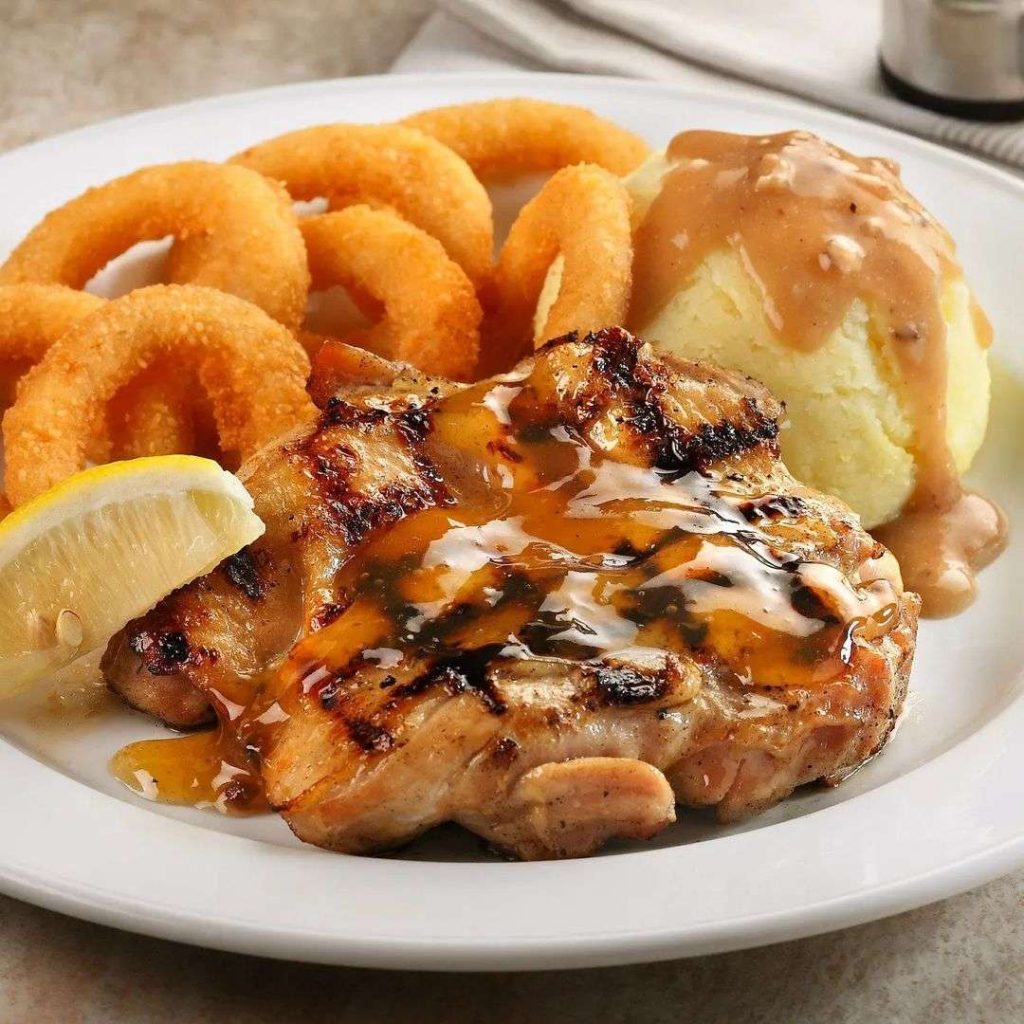 Astons Charboiled boneless chicken thigh served with tangy lemon-lime sauce