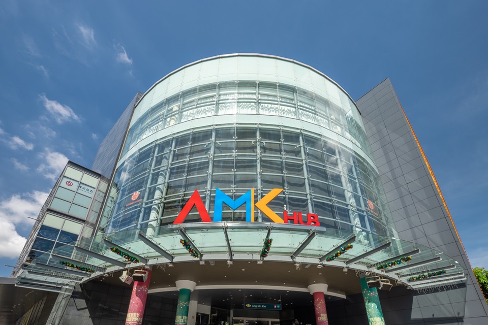 Interior of AMK Hub with signs of various food outlets, showcasing the mall's range of dining options from casual to family-friendly.