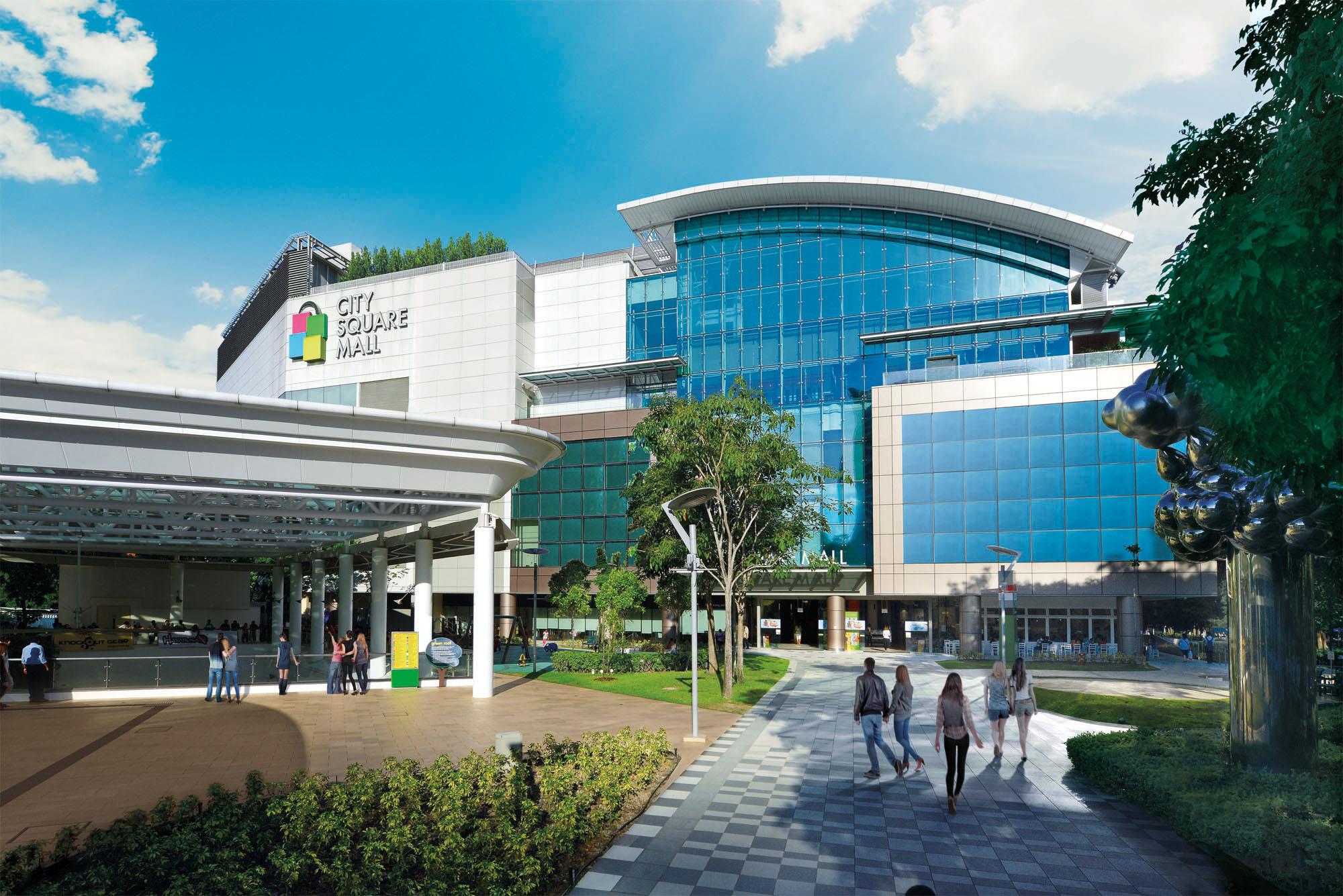 Aerial view of City Square Mall's atrium, showing a mix of green elements and various dining options, emphasizing its environmental and culinary focus.
