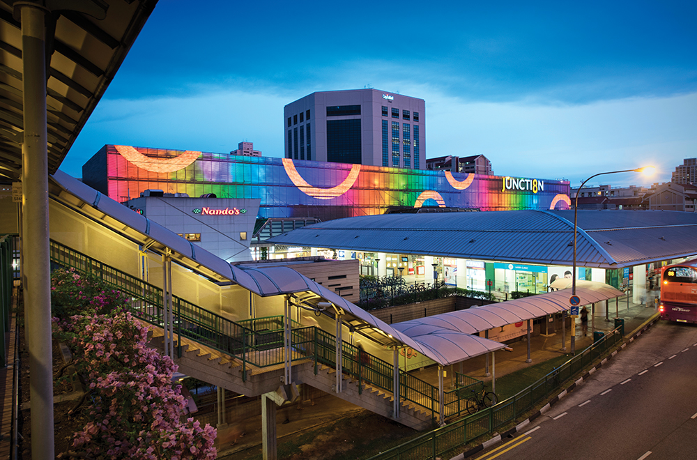 A bustling food court scene at Junction 8 with various stalls and diners, highlighting the mall's diverse food offerings.